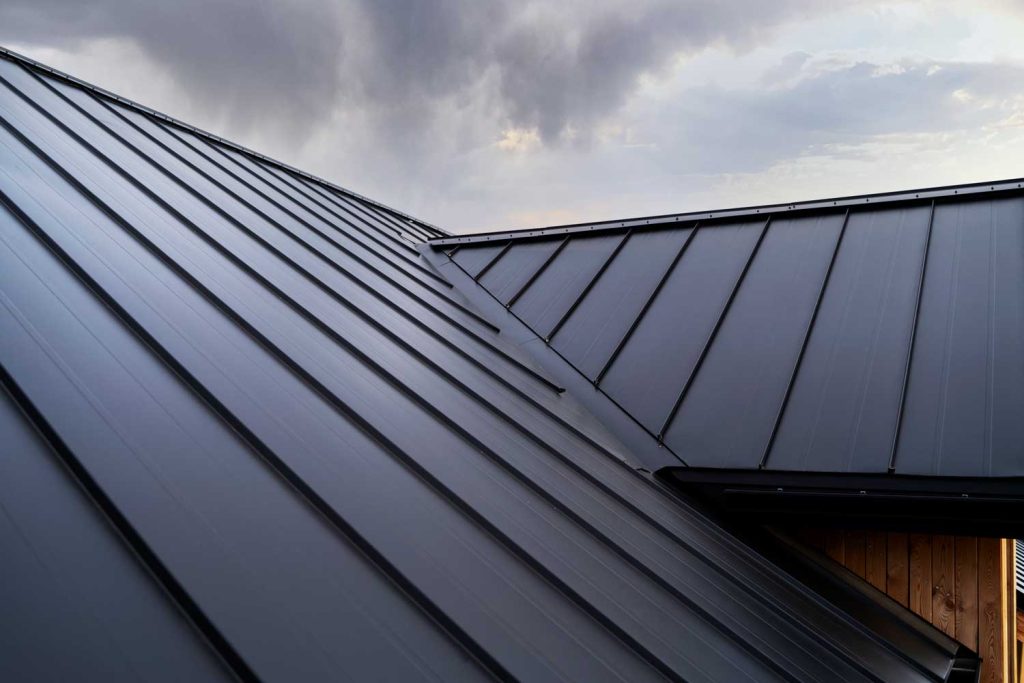 Modern steel roof under cloudy sky