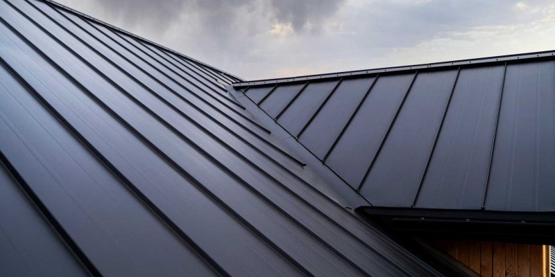 Modern steel roof under cloudy sky